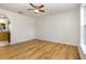 Bright living room with new floors and ceiling fan at 9532 Water Fern Cir, Clermont, FL 34711