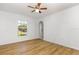 Bright living room with new floors and ceiling fan at 9532 Water Fern Cir, Clermont, FL 34711