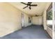 Covered patio area with ceiling fans for comfortable outdoor living at 9532 Water Fern Cir, Clermont, FL 34711