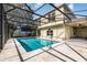 Inviting screened-in pool with patio, perfect for relaxation and outdoor entertainment at 9532 Water Fern Cir, Clermont, FL 34711