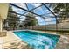 This screened-in pool area offers privacy and outdoor enjoyment at 9532 Water Fern Cir, Clermont, FL 34711