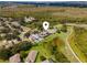 This neighborhood has easy golf course access, nearby shopping, and mature tree coverage at 9563 Myrtle Creek Ln, Orlando, FL 32832