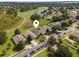 Scenic aerial view showing proximity to a golf course and lake at 9563 Myrtle Creek Ln, Orlando, FL 32832