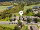 This is a neighborhood view near the golf course showing the house in proximity to recreational ammenities at 9563 Myrtle Creek Ln, Orlando, FL 32832