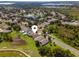 Aerial view of suburban neighborhood close to a golf course at 9563 Myrtle Creek Ln, Orlando, FL 32832