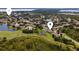 Beautiful aerial view of the community, showcasing the lakes, lush landscaping, and well-spaced homes at 9563 Myrtle Creek Ln, Orlando, FL 32832