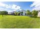 Well-manicured backyard with lush green lawn and privacy, perfect for outdoor enjoyment at 9563 Myrtle Creek Ln, Orlando, FL 32832