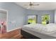 Inviting bedroom with expansive window and views to the lawn and beyond at 9563 Myrtle Creek Ln, Orlando, FL 32832