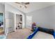 bedroom with blue racecar bed, ceiling fan, and closet at 9563 Myrtle Creek Ln, Orlando, FL 32832
