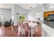 Dining area with views through slider to lawn and a bar separating the kitchen at 9563 Myrtle Creek Ln, Orlando, FL 32832