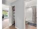 Hallway view with closet and bathroom access, showcasing the home's layout at 9563 Myrtle Creek Ln, Orlando, FL 32832