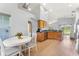 Open-concept kitchen with stainless appliances and a sun-filled dining area at 9563 Myrtle Creek Ln, Orlando, FL 32832