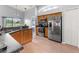 Bright, open kitchen featuring stone countertops and views to the lawn and beyond at 9563 Myrtle Creek Ln, Orlando, FL 32832
