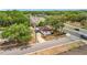 Aerial view showcasing the house and nearby greenery at 1000 E Dixie Ave, Leesburg, FL 34748