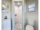 Bathroom featuring a walk-in shower, vanity and toilet at 1000 E Dixie Ave, Leesburg, FL 34748