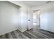 Bedroom with gray wood-look flooring and a closet provides entry to other areas of the home at 1000 E Dixie Ave, Leesburg, FL 34748