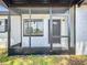 Close-up of the screened front porch, providing a sheltered and inviting entrance to the home at 1000 E Dixie Ave, Leesburg, FL 34748