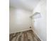 Laundry room featuring modern flooring, shelf, and hook at 1000 E Dixie Ave, Leesburg, FL 34748
