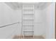 Walk-in closet featuring built-in shelving and a clothes rod for optimal organization at 10059 Sali Dr, Orlando, FL 32817