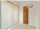 Hallway with light tile flooring, and access to closet or storage space at 10059 Sali Dr, Orlando, FL 32817