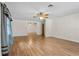 Open living room featuring wood floors, ceiling fan, and natural light at 10059 Sali Dr, Orlando, FL 32817