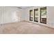 Neutral living room featuring three large windows offering ample natural light at 10059 Sali Dr, Orlando, FL 32817