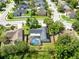 Aerial shot featuring a home with a screened in-ground pool and manicured lawn at 1014 Seminole Creek Dr, Oviedo, FL 32765