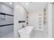 Luxurious bathroom showcasing a freestanding tub and a walk-in shower with a modern tile design at 1014 Seminole Creek Dr, Oviedo, FL 32765