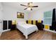 Comfortable bedroom with natural light and a white and yellow color scheme at 1014 Seminole Creek Dr, Oviedo, FL 32765