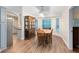 Well-lit dining room features hardwood floors, a beautiful hutch, and bright windows at 1014 Seminole Creek Dr, Oviedo, FL 32765