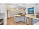 Modern kitchen with granite countertops, stainless steel appliances, and a breakfast bar at 1014 Seminole Creek Dr, Oviedo, FL 32765