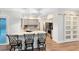 Bright and modern kitchen with granite countertops, stainless steel appliances, and a breakfast bar at 1014 Seminole Creek Dr, Oviedo, FL 32765