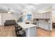 Modern kitchen featuring granite countertops, a breakfast bar, stainless steel appliances, and ample cabinet space at 1014 Seminole Creek Dr, Oviedo, FL 32765