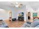 Open-concept living room with hardwood floors, a ceiling fan, and neutral tones at 1014 Seminole Creek Dr, Oviedo, FL 32765