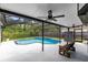 Relaxing outdoor space with ceiling fans, bench seating, and a pool area at 1014 Seminole Creek Dr, Oviedo, FL 32765