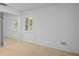 Bright bedroom with a carpet, sliding door closet and shuttered window at 102 Old Hickory, Longwood, FL 32750