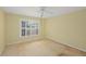 Comfortable bedroom with a ceiling fan and window, offering a peaceful retreat at 102 Old Hickory, Longwood, FL 32750