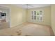 View of a bedroom featuring a ceiling fan and window with plantation shutters at 102 Old Hickory, Longwood, FL 32750