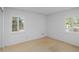 This bedroom has neutral walls, and windows with white shutters letting in lots of natural light at 102 Old Hickory, Longwood, FL 32750