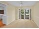 Inviting dining area with French doors leading to the outdoor pool area, perfect for entertaining at 102 Old Hickory, Longwood, FL 32750
