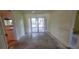 Spacious dining room with doors that open up to the screened in porch and pool at 102 Old Hickory, Longwood, FL 32750