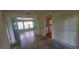 Bright dining area leads to a sunny living room and adjacent kitchen, offering a versatile layout at 102 Old Hickory, Longwood, FL 32750