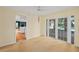 View of a bright living room with glass doors and a glimpse of the pool at 102 Old Hickory, Longwood, FL 32750