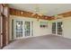 Enclosed patio with brick accents and multiple ceiling fans at 102 Old Hickory, Longwood, FL 32750
