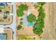 Overhead view showcases a ranch style home with pool and tree coverage on a large lot at 106 8Th St, Lake Hamilton, FL 33851