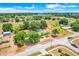 Aerial view shows a large lot outlined with a ranch home, pool, and spacious green yard at 106 8Th St, Lake Hamilton, FL 33851