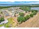 Aerial photo outlines a large lot with a ranch home, mature trees, and lake views at 106 8Th St, Lake Hamilton, FL 33851
