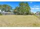 Spacious backyard with mature trees at 106 8Th St, Lake Hamilton, FL 33851
