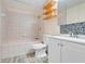 Well-lit bathroom featuring tile flooring, a vanity, and built-in shelving at 106 8Th St, Lake Hamilton, FL 33851
