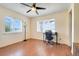 Bright bedroom featuring hardwood floors, a desk, and two windows providing ample natural light at 106 8Th St, Lake Hamilton, FL 33851